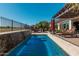 Inviting pool with waterfall feature and patio furniture at 3415 E Sports Dr, Gilbert, AZ 85298