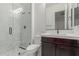 Modern bathroom with a glass shower and dark wood vanity at 4547 S Banning Dr, Gilbert, AZ 85297