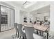 Bright dining room featuring a wood table and gray chairs at 4547 S Banning Dr, Gilbert, AZ 85297