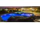 Night view of the pool and spa with rock waterfall at 4547 S Banning Dr, Gilbert, AZ 85297