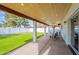 Covered patio with seating area and grassy backyard view at 6262 N 85Th St, Scottsdale, AZ 85250