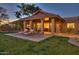 Backyard patio with lounge chairs and house view at 9515 E Sundance Trl, Scottsdale, AZ 85262