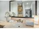 Elegant bathroom with a large mirror and modern vanity at 9515 E Sundance Trl, Scottsdale, AZ 85262