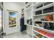 Custom closet with ample shelving for clothing and accessories at 9515 E Sundance Trl, Scottsdale, AZ 85262