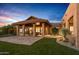 Stunning home exterior with a covered patio and beautifully landscaped yard at 9515 E Sundance Trl, Scottsdale, AZ 85262