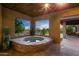 Relaxing hot tub with a stunning sunset view at 9515 E Sundance Trl, Scottsdale, AZ 85262