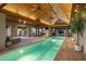 Luxury indoor pool with spa and seating area at 9515 E Sundance Trl, Scottsdale, AZ 85262