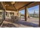 Stone patio with dining table and chairs at 9515 E Sundance Trl, Scottsdale, AZ 85262