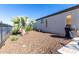 Landscaped backyard with gravel and grill at 97 E Alcatara Ave, San Tan Valley, AZ 85140