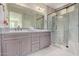 Modern bathroom with dual vanities, large shower, and updated fixtures at 97 E Alcatara Ave, San Tan Valley, AZ 85140