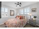 Cozy bedroom with a ceiling fan and window shutters at 97 E Alcatara Ave, San Tan Valley, AZ 85140