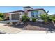 One-story home with a welcoming front yard and two-car garage at 97 E Alcatara Ave, San Tan Valley, AZ 85140