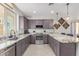 Modern kitchen featuring granite countertops and ample cabinetry at 97 E Alcatara Ave, San Tan Valley, AZ 85140