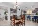 Well-equipped kitchen with granite counters and dark wood cabinets at 97 E Alcatara Ave, San Tan Valley, AZ 85140