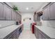 Bright laundry room with washer, dryer, and ample counter space at 97 E Alcatara Ave, San Tan Valley, AZ 85140