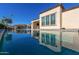 Clean lines and stunning reflection of the home in the pool at 97 E Alcatara Ave, San Tan Valley, AZ 85140