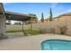 Inviting backyard oasis with a sparkling pool, patio, and lush lawn at 1337 N Rosemont --, Mesa, AZ 85205