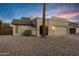 Cute one-story house with a single-car garage and desert landscaping at 1337 N Rosemont --, Mesa, AZ 85205