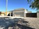 House exterior featuring a two-car garage and rock landscaping at 1337 N Rosemont --, Mesa, AZ 85205