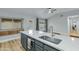 Kitchen island with sink, faucet, and modern gray cabinets at 1337 N Rosemont --, Mesa, AZ 85205