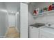 Laundry room with washer, dryer, and additional shelving at 1337 N Rosemont --, Mesa, AZ 85205