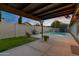 Relaxing pool area with patio cover, creating a private retreat at 1337 N Rosemont --, Mesa, AZ 85205