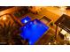 Night view of a refreshing blue pool and spa at 14959 S 184Th Ave, Goodyear, AZ 85338