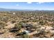 Aerial view of a ranch-style home with a pool and desert landscape at 30247 N 164Th St, Scottsdale, AZ 85262