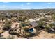 Aerial view showcasing a house, pool, and expansive desert landscape at 30247 N 164Th St, Scottsdale, AZ 85262