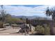 Relaxing patio area with mountain views, stone features, and seating at 30247 N 164Th St, Scottsdale, AZ 85262