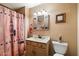 Clean bathroom with wood vanity, updated fixtures, and a shower/tub combo at 30247 N 164Th St, Scottsdale, AZ 85262