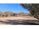 Exterior view of a single-story home nestled in a desert setting at 30247 N 164Th St, Scottsdale, AZ 85262