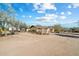 Ranch style home with a gravel driveway and desert landscape at 30247 N 164Th St, Scottsdale, AZ 85262