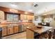 Kitchen with wood cabinets, butcher block island, and stainless steel appliances at 30247 N 164Th St, Scottsdale, AZ 85262