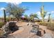 Peaceful backyard patio with fire pit and seating area at 30247 N 164Th St, Scottsdale, AZ 85262