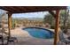 Kidney-shaped pool with a pergola and mountain views at 30247 N 164Th St, Scottsdale, AZ 85262