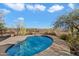 Relaxing kidney-shaped pool surrounded by desert landscaping at 30247 N 164Th St, Scottsdale, AZ 85262