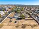 Expansive aerial view showcases the property and neighborhood with mountain views at 3740 E Edna Ave, Phoenix, AZ 85032