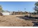 Fenced backyard featuring a detached garage, and desert landscaping with a gravel ground at 3740 E Edna Ave, Phoenix, AZ 85032