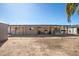 View of the home's backyard, showcasing the covered patio and swingset at 3740 E Edna Ave, Phoenix, AZ 85032