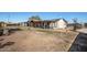 Rear exterior showing the spacious backyard, partially covered patio, and room for gardening at 3740 E Edna Ave, Phoenix, AZ 85032