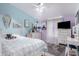 Colorful bedroom with a ceiling fan, tiled floors, and a blue and purple color scheme at 3740 E Edna Ave, Phoenix, AZ 85032