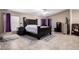 Cozy main bedroom featuring tiled floors, a ceiling fan, and dark wooden furniture at 3740 E Edna Ave, Phoenix, AZ 85032