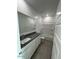 Bathroom with granite countertop, white cabinets, and shower at 38085 W Excussare Way, Maricopa, AZ 85138