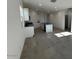 Open-concept kitchen featuring an island, granite countertops, and stainless steel appliances at 38085 W Excussare Way, Maricopa, AZ 85138