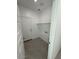 Tile Laundry Room with White walls and white door at 38085 W Excussare Way, Maricopa, AZ 85138