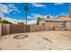 A sunny outdoor area featuring a private gated space and desert landscaping at 3835 E Leland St, Mesa, AZ 85215