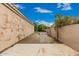 A serene outdoor space with a concrete patio and lush greenery in a fenced yard at 3835 E Leland St, Mesa, AZ 85215