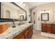 Bathroom with double sink granite vanity, large mirror, and tile flooring at 3835 E Leland St, Mesa, AZ 85215