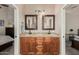 Bathroom featuring double sinks, granite countertops, and decorative framed mirrors at 3835 E Leland St, Mesa, AZ 85215